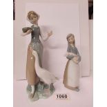 2 Lladro figures being a girl with a goose and a girl with a piglet