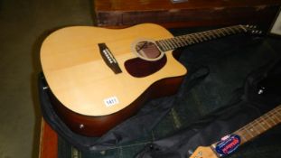An acoustic guitar and case