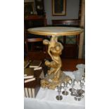 A figural table with round top