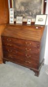 A mahogany bureau with 4 drawers