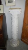 A plaster torchere stand,