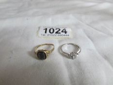 A white gold 7 stone diamond ring size I and a black onyx yellow gold ring size L