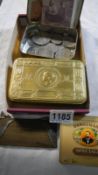 A WWI tin and contents and box of coins