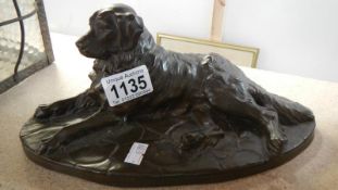 A Reding bronze dog