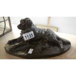 A Reding bronze dog