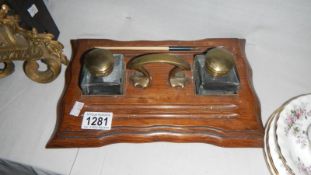 An oak inkstand with pair of inkwells
