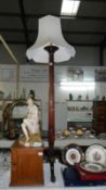 A Victorian mahogany torchere converted to a standard lamp
