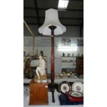 A Victorian mahogany torchere converted to a standard lamp