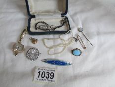 A mixed lot of jewellery including lovers pendant, silver and enamel brooch,