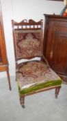 A Victorian mahogany framed chair (upholstery a/f)