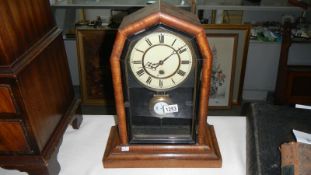 A mahogany mantel clock (enamel dial a/f)