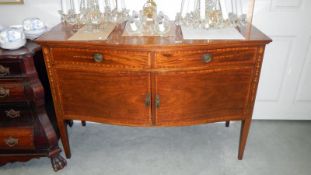 A mahogany inlaid sideboard