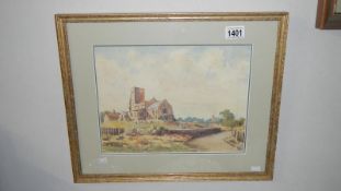 A framed and glazed watercolour Village Church signed Audrey Youlkham