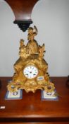A gilt French clock with Key & Pendulum (In working order)