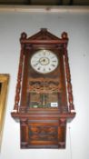 A wall clock with carved decoration