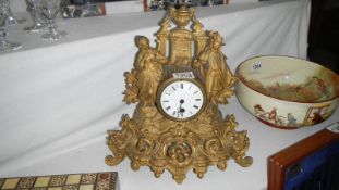 A gilded spelter mantel clock