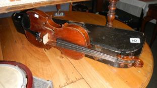 A violin with bow in wooden case