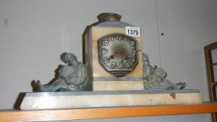 An Art Deco style mantel clock with Boy and Girl figure (springs ok)