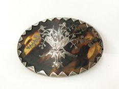 A tortoiseshell brooch