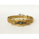 A yellow metal bangle set turquoise and seed pearls