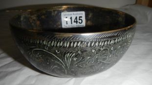 An old patinated brass bowl with Eastern decoration