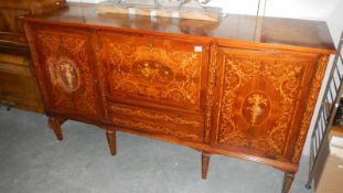 A large 19th C marquetry inlaid sideboard