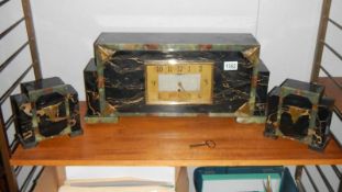 A 3 piece Art Deco style clock garniture set (spring wound to limit,