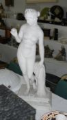 A classical style stone statue of a lady,