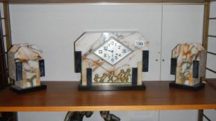 A 3 piece Art Deco style clock garniture set (both springs ok, needs feather,