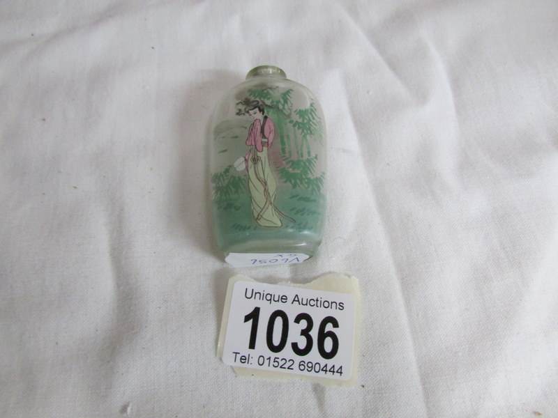 A scent bottle with oriental ladies depiction, - Image 2 of 2