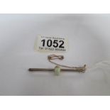 A 9ct gold and opal bar brooch