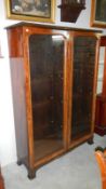 A mahogany display cabinet