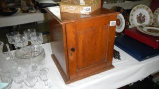 An oak storage box with dividers