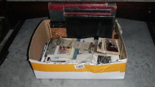 A quantity of old ledgers, postcards,
