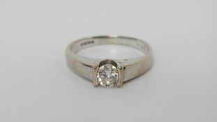 An 18ct white gold quarter carat solitaire diamond ring