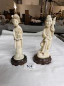 A pair of 19th century signed ivory figures