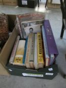 A box of needlework related books