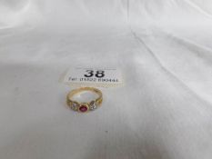 An 18ct yellow gold diamond and ruby ring