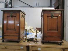 A pair of Victorian fall front perdoniums together with a pair of brass candlesticks and a coal
