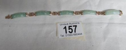 A 9ct gold and jade bracelet