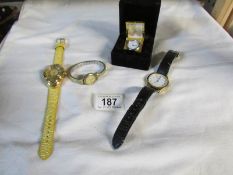 3 wrist watches and a boxed miniature brass clock