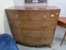 A 2 over 3 mahogany bow front chest of drawers