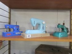 3 children's sewing machines being a blue Vulcan Regal,