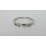 An 18ct white gold eternity ring with channel set diamonds