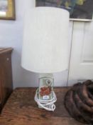 A pottery table lamp with shade