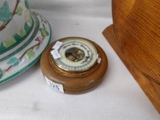 A small circular barometer