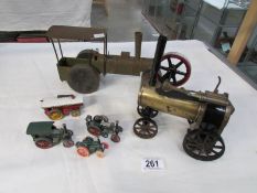 An early Tri-ang tinplate steam roller with wooden wheels a Mamod steam engine and other models