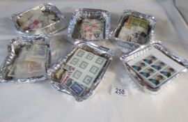 A large quantity of loose mainly European stamps