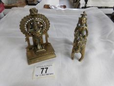 An antique brass Indian Deity figure and another seated on horse