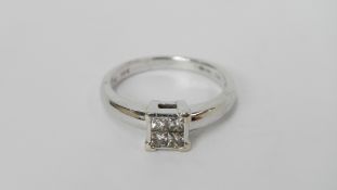 An 18ct white gold 20pt diamond ring